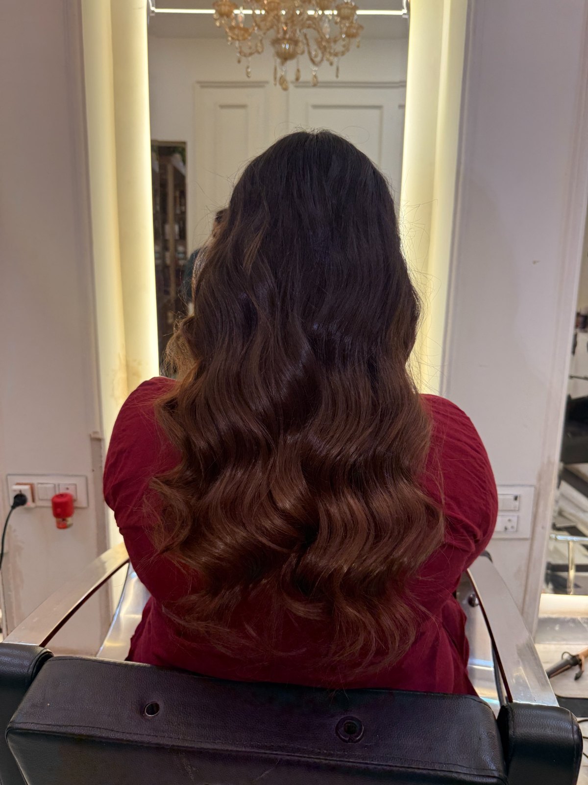Brown hair colour with soft waves by Aura, finished style